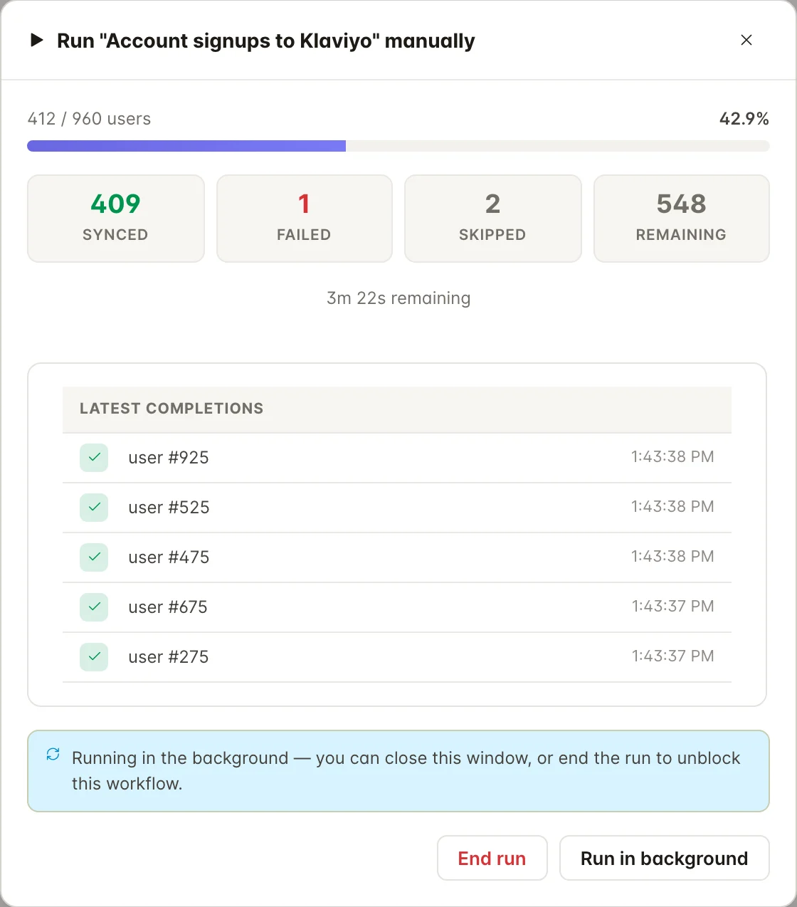 FlowSync's manual run dialog showing 412 of 960 users processed, with synced, failed and skipped counts and a live completions feed.